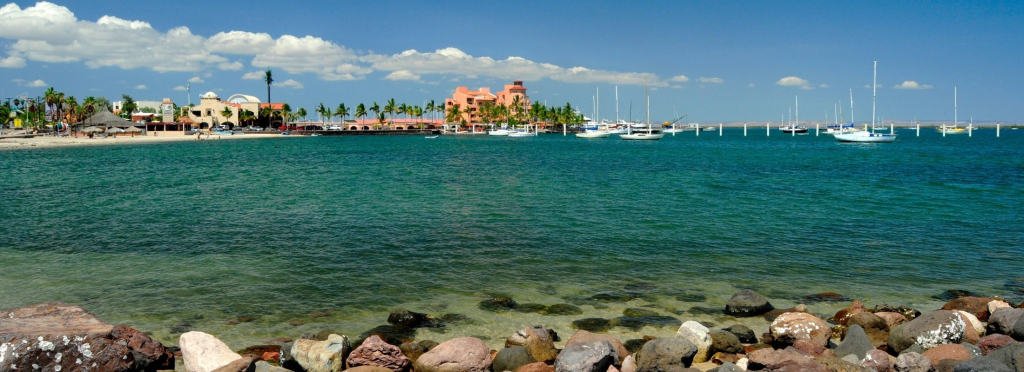 The La Paz Real Estate Guide - Berkshire Hathaway HomeServices Baja Real Estate Beach front in La Paz with luxury houses and sailboats
