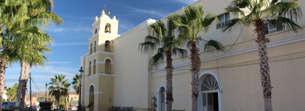 The Todos Santos Real Estate Guide - Berkshire Hathaway HomeServices Baja Real Estate Town in Todos Santos with a church