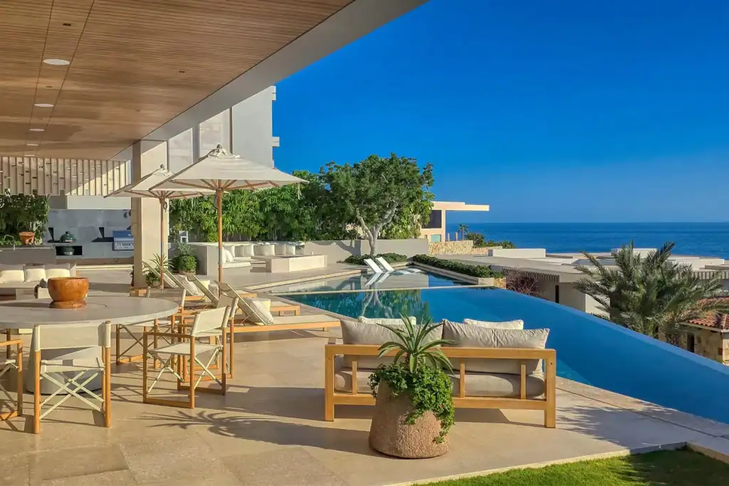 Contemporary Chileno Bay residence with covered terrace, infinity pool, outdoor living area, and Sea of Cortez views